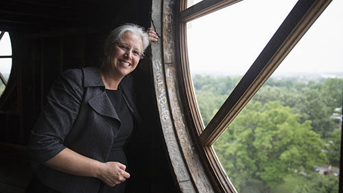 gina bufe posing for a professional portrait in front of the Dome window in academic hall