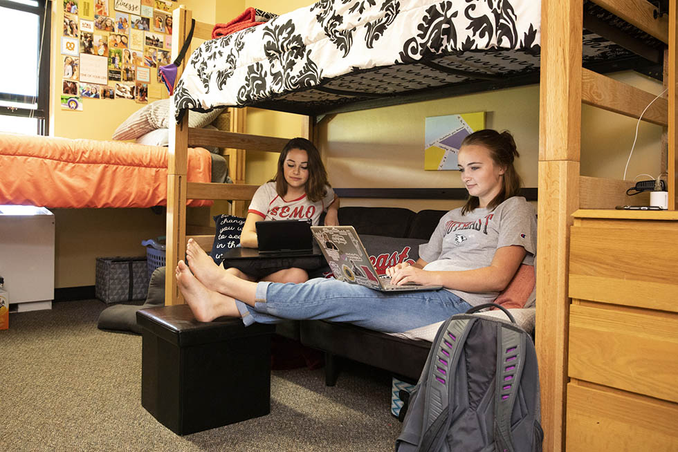Roommates study at their desks in their dorm room at Southeast.