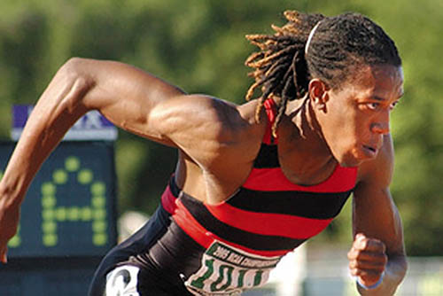 miles smith, a young black man, competes in a track competition
