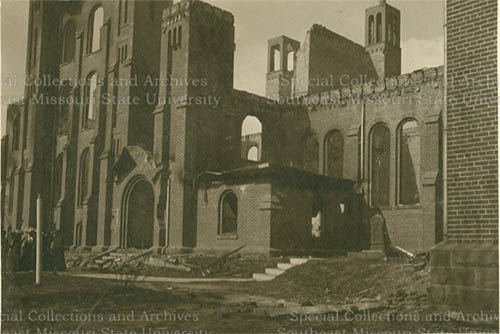 the burned out husk of the old Normal school represented in a black and white old photo