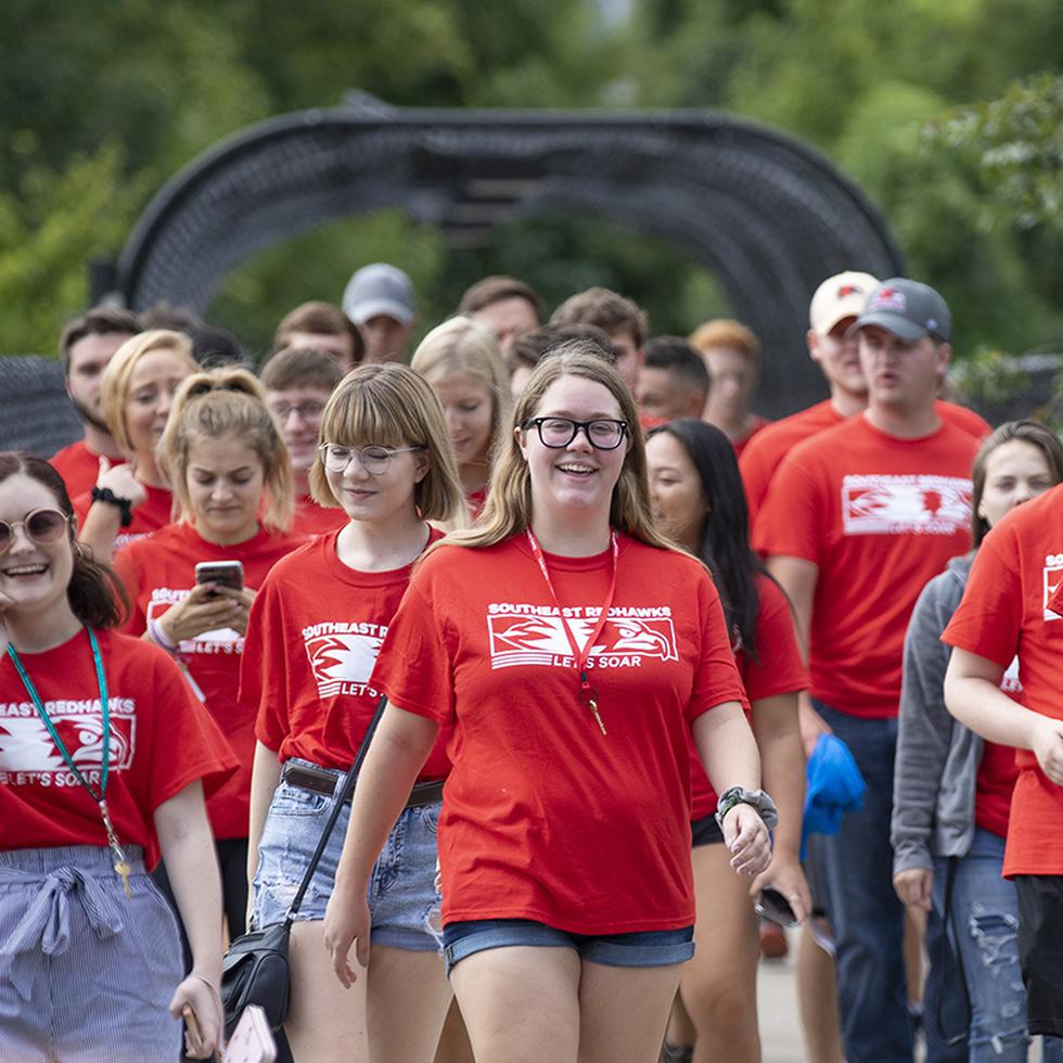 students walking and smiling on campus