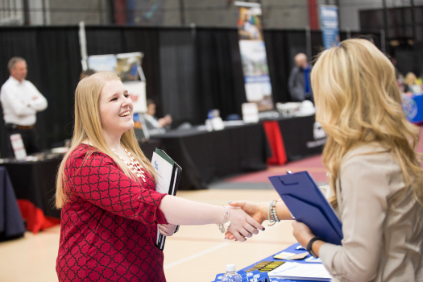 Student shaking hands with a future employer at the SEMO Career Expo. 