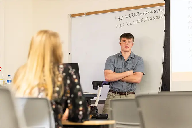 A mathematics major at SEMO teaching a class.