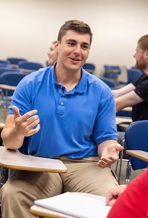 Students in a bachelor's degree in business management class at SEMO running on-the-job simulations for practice.