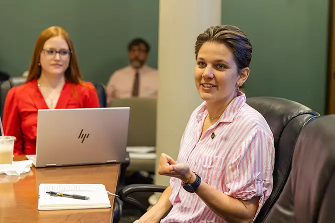 SEMO bs in political science student contributes to meeting with Board of Governors inside a conference room.