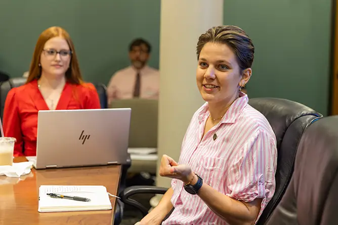 A student speaks at an on-campus meeting.