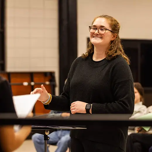 SEMO Alumni, Ella Crader, conducts her middle school choir students during a performance at Sikeston Middle School.