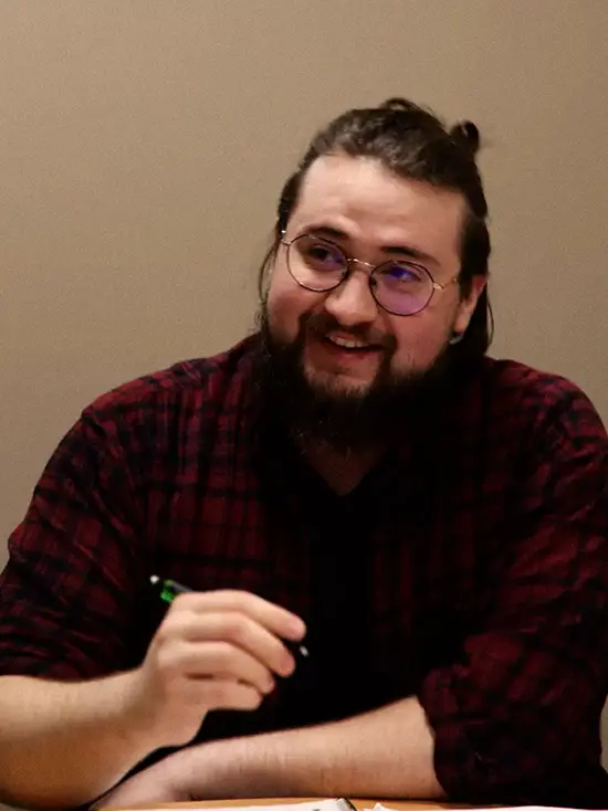 Josh, a communication disorders student, takes notes during observations. 