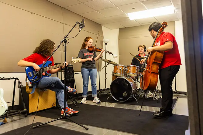 Students utilize an on-campus recording studio for a class project at SEMO, a top-rated music school in Missouri. 