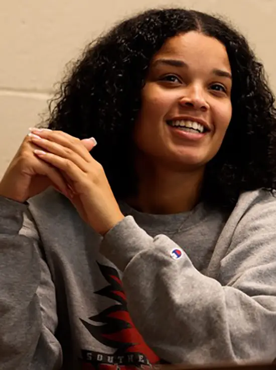 Lamiyah Mackins, a student in the social work program at Southeast Missouri State University, happily sitting in a social work class