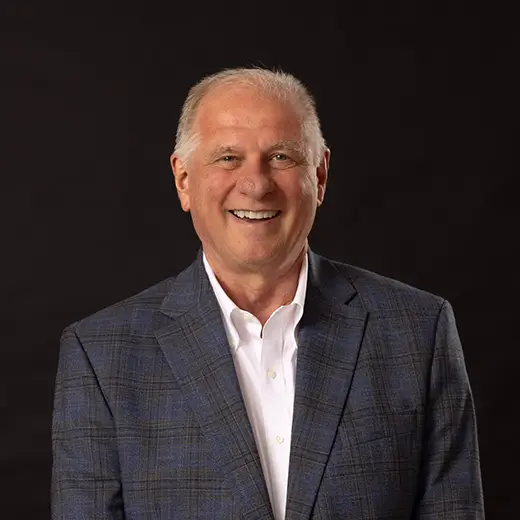 Mike Ward smiles for his university headshot. 