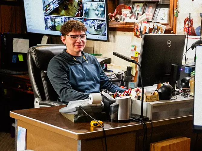 Will, a student in the bs political science program at SEMO, working behind a desk as alderman in his hometown.