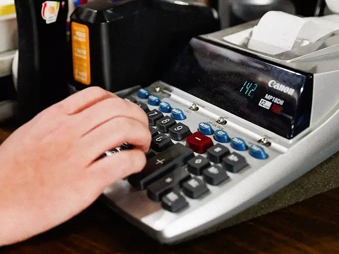 Will typing on a calculator while gaining real world experience for his bachelor’s of political science.