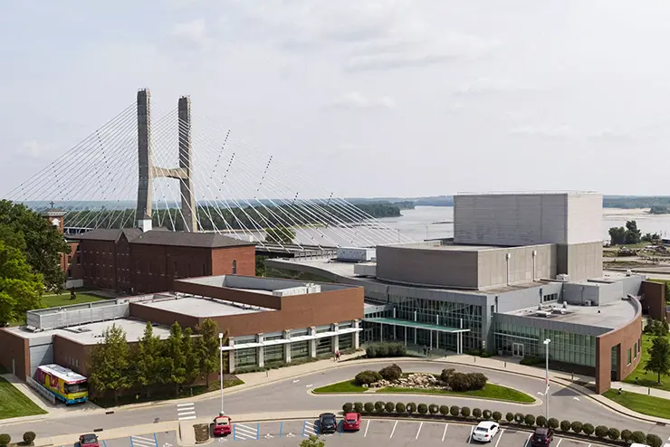 An aerial view of the River Campus in front of the bridge crossing over the Mississippi River. 