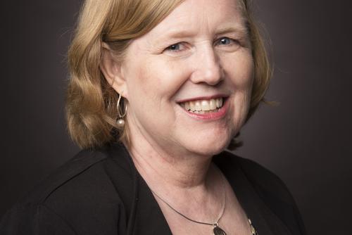 Nanci Burchell smiles for a portrait.