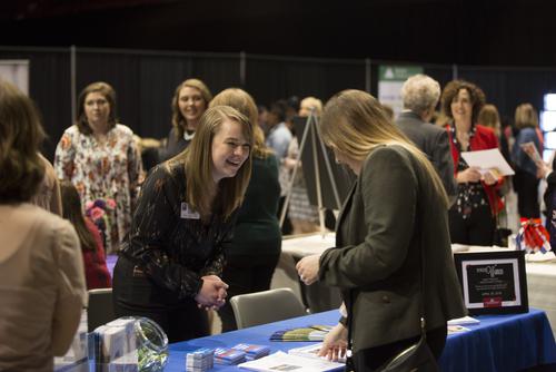 A SEMO student meets local business women at an event.