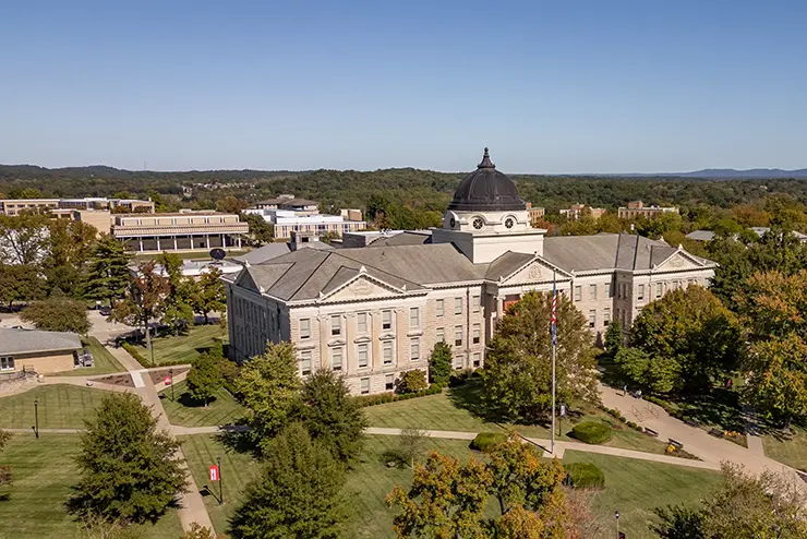 a wide view of SEMO's north campus featuring academic hall and other buildings behind it washed in sunlight