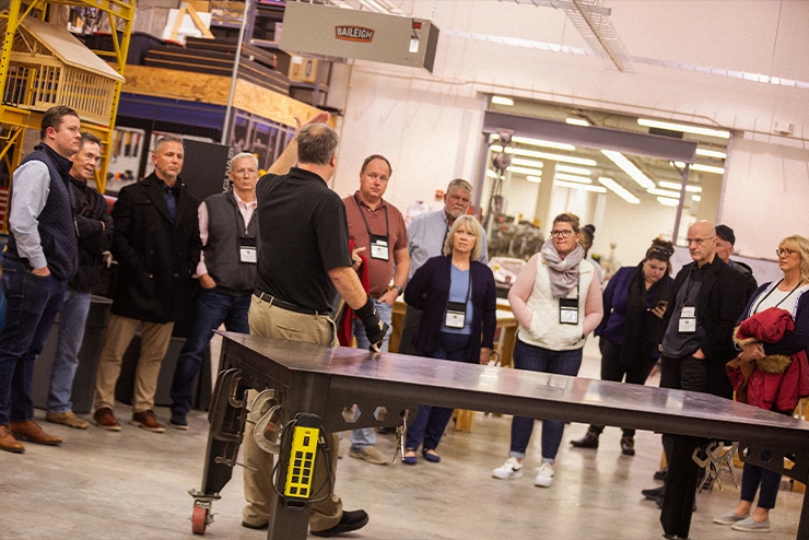 a SEMO student talks about her presentat to two listeners