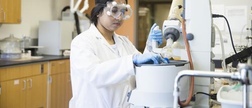 Graduate student, Rawshawn Ara Ripa, works with the Rotary Evaporator in a Magill Research Lab.