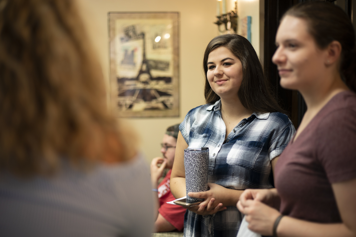 Students smile while mingling at the honors picnic during opening week.