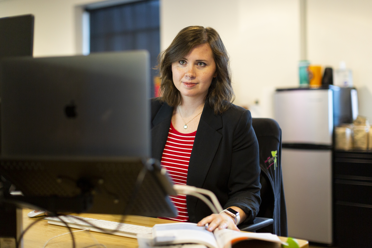 A student works at a computer station.