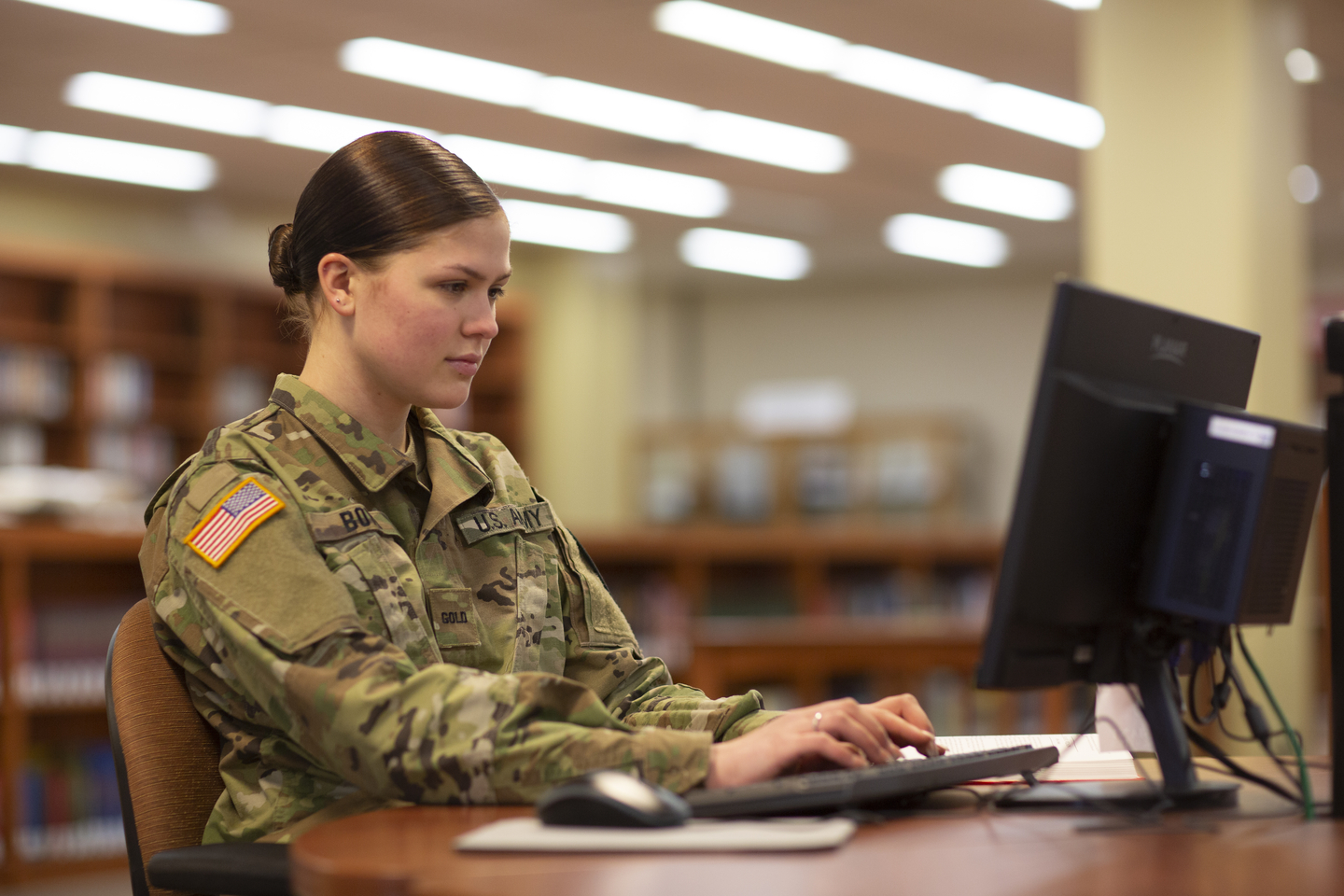 A Show Me Gold student works at a computer in Kent Library.