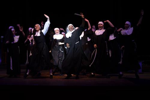 During a production of “Sister Act” students in the musical theatre program sing and dance joyfully in a closing number. 