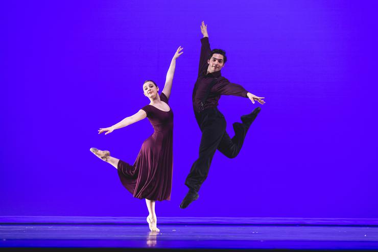 Two BA dancers strike poses while on stage in the Bedell Performance Hall. 