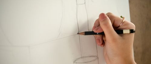 close up of a bachelors art degree student at southeast missouri state university student drawing in her art for drawing class