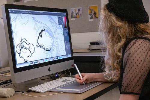 An art degree student creates work for their class at Southeast Missouri State University on March 24, 2021, in Cape Girardeau, Missouri. 