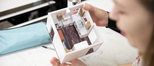 SEMO student in interior design school in missouri shows model she created for a local men's shelter. 