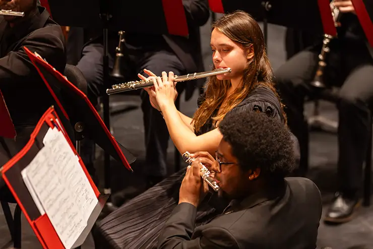 music students play the flute for the wind symphoney ensemble