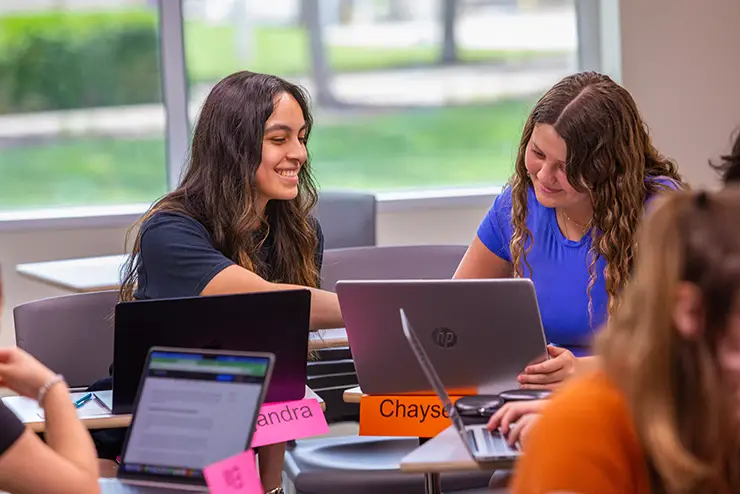 a group of SEMO business students work together in a group during a class project