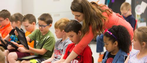 bachelor of science in elementary education  as they interact on tablets to learn