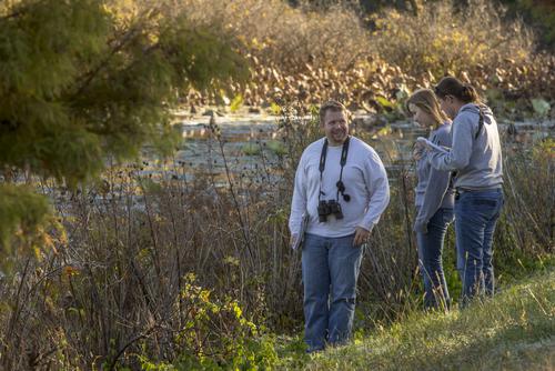 Students study a wetlands ecosystem during an Ecology lab.