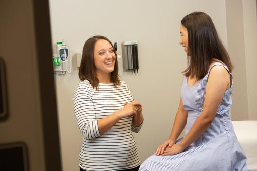 A medical professional meets with a patient at the Campus Health Clinic. 
