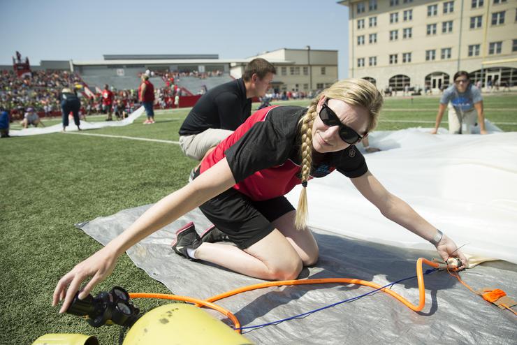 Kaci Heins prepares to launch a high-altitude weather balloon at the SEclipse 2017 festivities. 