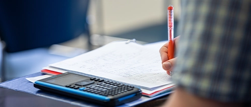 Data Science student taking note on a note pad during hyflex course from SEMO math department instructor preparing for a career in data science 