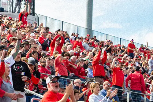 Fans cheering on the Redhawks at a SEMO sporting event