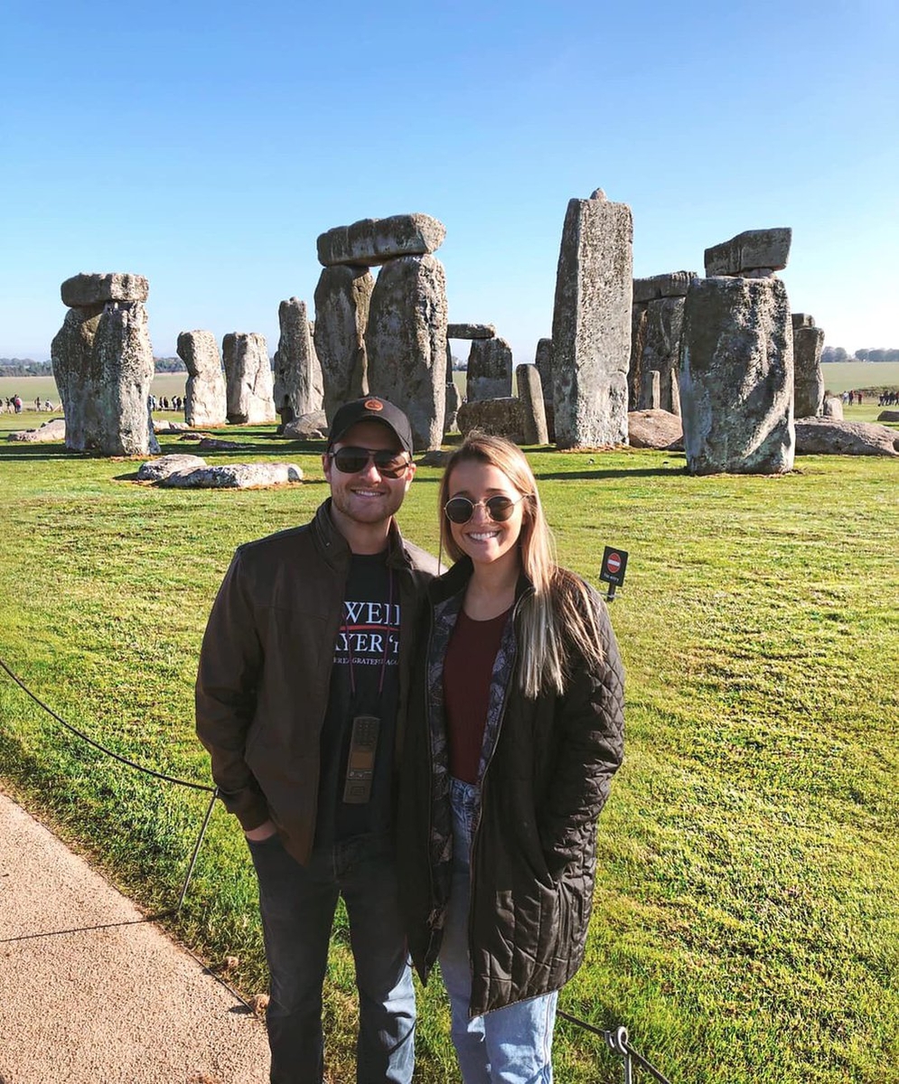 Students stand in front of Stonehedge while studying abroad.