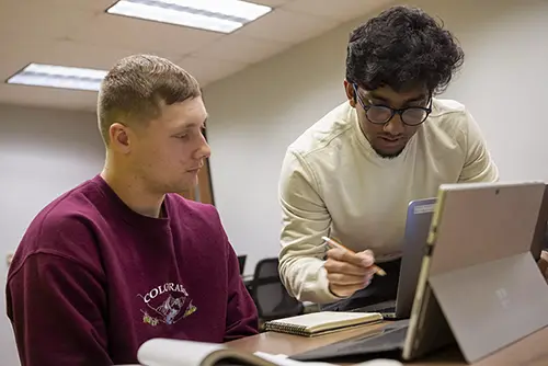 one semo student helps another with an assigment, tutoring