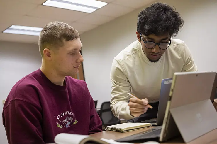 one semo student helps another with an assigment, tutoring