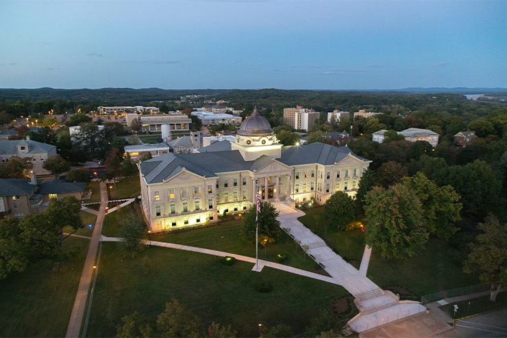 An image of Academic Hall at Southeast in the twilight hours with lights on at SEMO