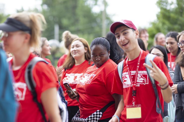 Two Southeast Missouri State University freshmen brightly smiling at the camera on campus.