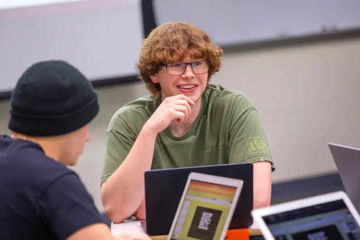 a SEMO student sits in a group in his class for a discussion