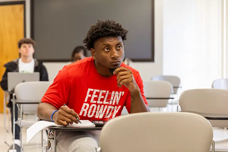 a SEMO student sits in class and listens attentively to the instructor