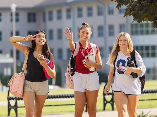 students smiling at river campus