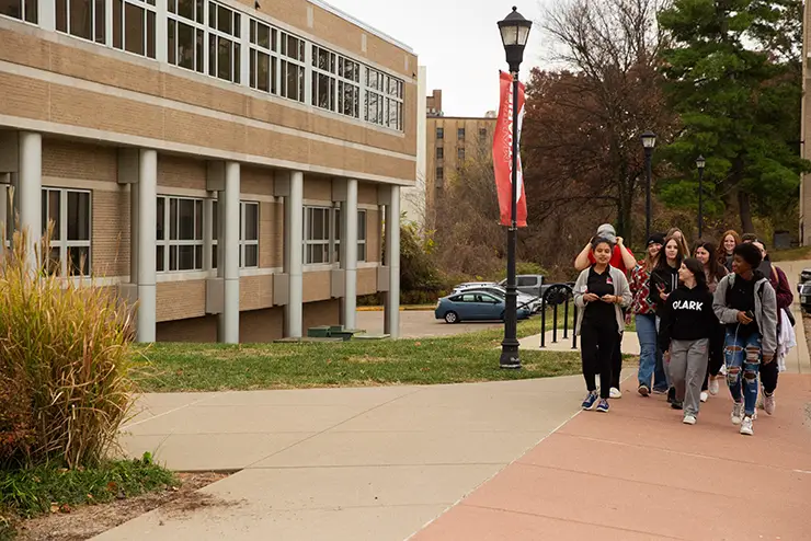 a group of prospective students participates in a walking campus tour