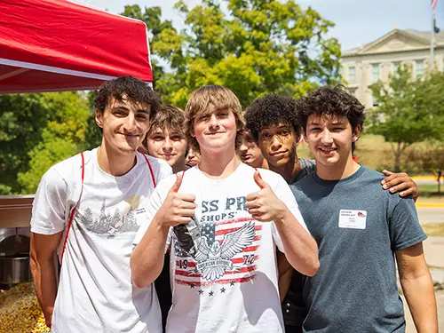 three regional high school students pose for a photo during college colors day at SEMO