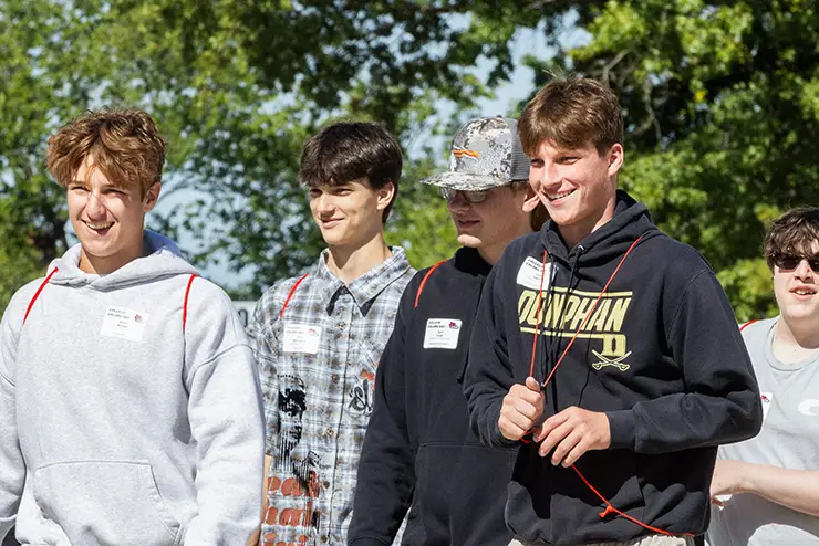 a group of high school boys visit campus during college colors day
